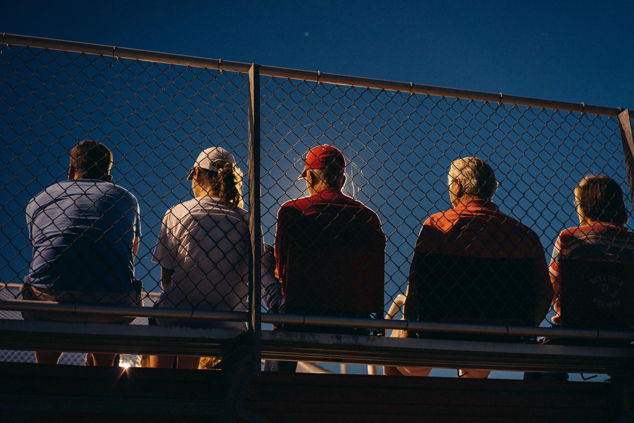 Young football player supported by family
